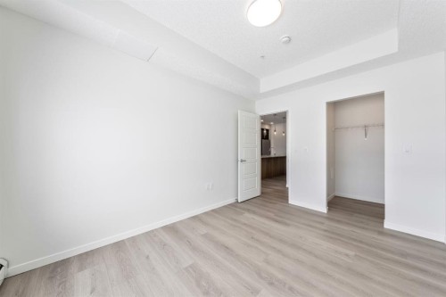419-245 Edith Place Nw, Calgary, AB - Indoor Photo Showing Other Room