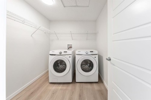 419-245 Edith Place Nw, Calgary, AB - Indoor Photo Showing Laundry Room