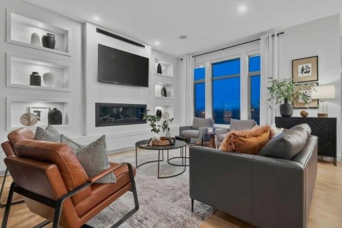 55 Cougar Plateau Circle Sw, Calgary, AB - Indoor Photo Showing Living Room With Fireplace