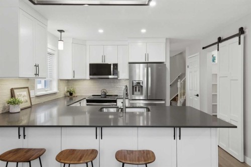 3426 5 Avenue Nw, Calgary, AB - Indoor Photo Showing Kitchen With Stainless Steel Kitchen With Double Sink With Upgraded Kitchen