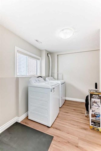 172 Sunset Heights, Crossfield, AB - Indoor Photo Showing Laundry Room