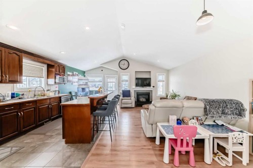 172 Sunset Heights, Crossfield, AB - Indoor With Fireplace