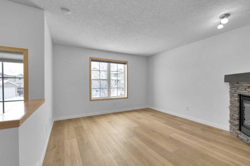 89 Covebrook Place Ne, Calgary, AB - Indoor Photo Showing Other Room With Fireplace