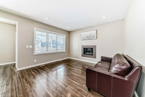 153 Van Slyke Way, Red Deer, AB - Indoor Photo Showing Living Room With Fireplace