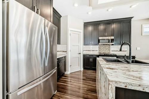 153 Van Slyke Way, Red Deer, AB - Indoor Photo Showing Kitchen With Stainless Steel Kitchen With Double Sink With Upgraded Kitchen