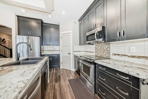 153 Van Slyke Way, Red Deer, AB - Indoor Photo Showing Kitchen With Stainless Steel Kitchen With Double Sink With Upgraded Kitchen