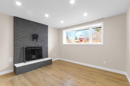 956 Bracewood Rise Sw, Calgary, AB - Indoor Photo Showing Living Room With Fireplace