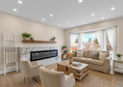 956 Bracewood Rise Sw, Calgary, AB - Indoor Photo Showing Living Room With Fireplace