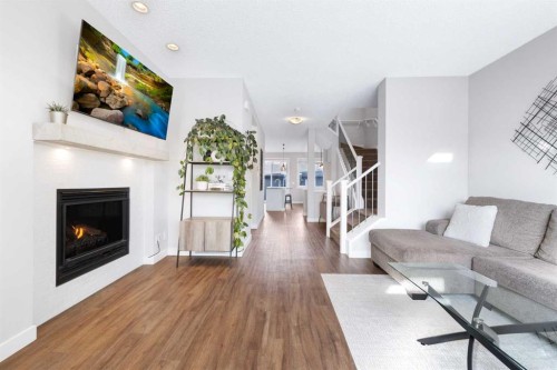 174 Seton Grove Se, Calgary, AB - Indoor Photo Showing Living Room With Fireplace