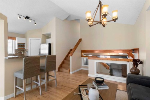 78 Hidden Spring Green Nw, Calgary, AB - Indoor With Fireplace