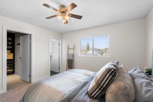 78 Hidden Spring Green Nw, Calgary, AB - Indoor Photo Showing Bedroom