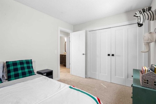78 Hidden Spring Green Nw, Calgary, AB - Indoor Photo Showing Bedroom