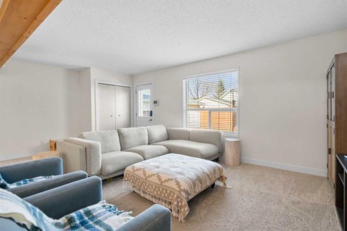 78 Hidden Spring Green Nw, Calgary, AB - Indoor Photo Showing Living Room