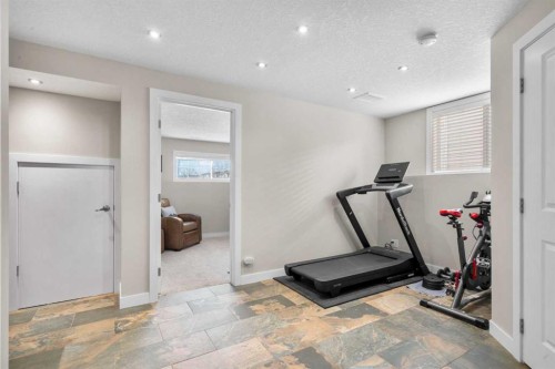 78 Hidden Spring Green Nw, Calgary, AB - Indoor Photo Showing Gym Room