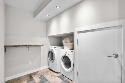 78 Hidden Spring Green Nw, Calgary, AB - Indoor Photo Showing Laundry Room