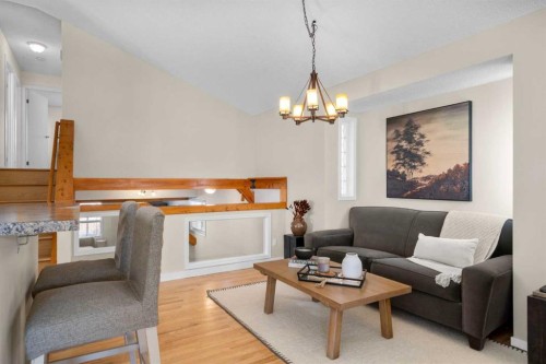 78 Hidden Spring Green Nw, Calgary, AB - Indoor Photo Showing Living Room