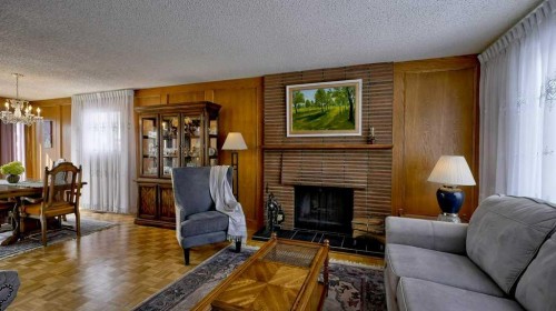 103 Rundlehorn Crescent Ne, Calgary, AB - Indoor Photo Showing Living Room With Fireplace