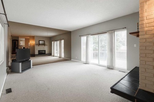 3035 Cedar Ridge Drive Sw, Calgary, AB - Indoor With Fireplace