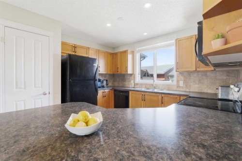 66 Auburn Bay Crescent Se, Calgary, AB - Indoor Photo Showing Kitchen With Double Sink