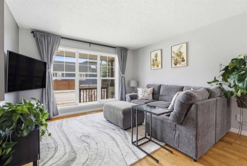 66 Auburn Bay Crescent Se, Calgary, AB - Indoor Photo Showing Living Room