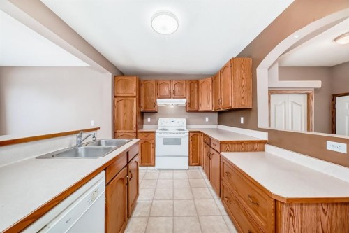 11 Coventry Link Ne, Calgary, AB - Indoor Photo Showing Kitchen With Double Sink