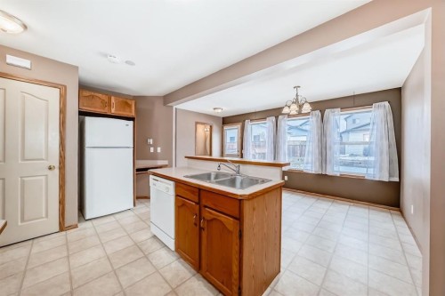 11 Coventry Link Ne, Calgary, AB - Indoor Photo Showing Kitchen With Double Sink