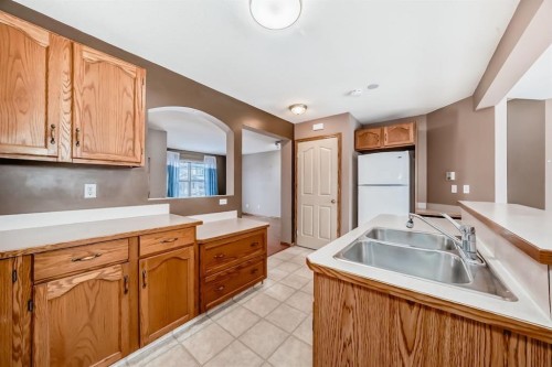 11 Coventry Link Ne, Calgary, AB - Indoor Photo Showing Kitchen With Double Sink