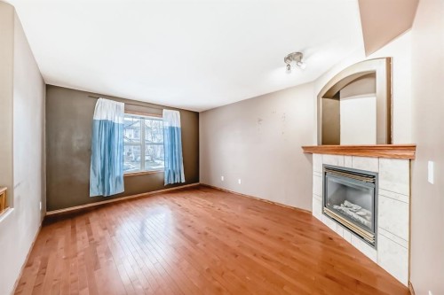 11 Coventry Link Ne, Calgary, AB - Indoor With Fireplace
