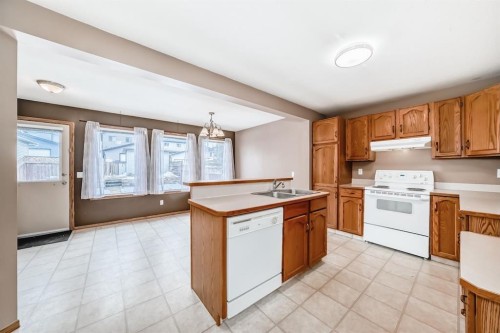 11 Coventry Link Ne, Calgary, AB - Indoor Photo Showing Kitchen With Double Sink