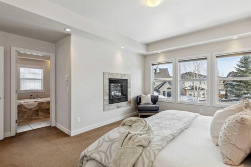 25 Mahogany Square Se, Calgary, AB - Indoor Photo Showing Bedroom With Fireplace