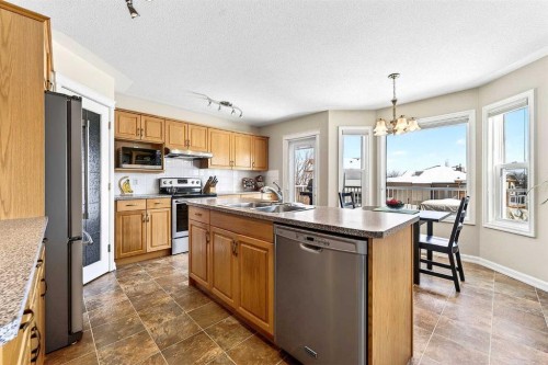 219 Hidden Ranch Circle Nw, Calgary, AB - Indoor Photo Showing Kitchen With Stainless Steel Kitchen With Double Sink