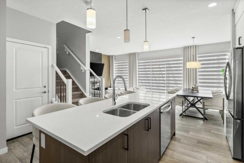 243 Silver Spruce Grove Sw, Calgary, AB - Indoor Photo Showing Kitchen With Stainless Steel Kitchen With Double Sink With Upgraded Kitchen