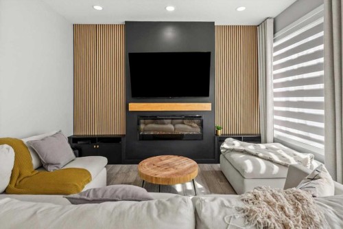 243 Silver Spruce Grove Sw, Calgary, AB - Indoor Photo Showing Living Room With Fireplace