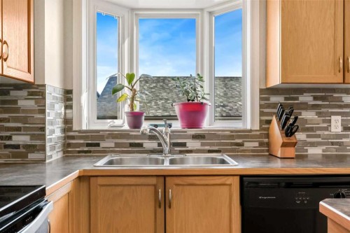 40 Eversyde Circle Sw, Calgary, AB - Indoor Photo Showing Kitchen With Double Sink