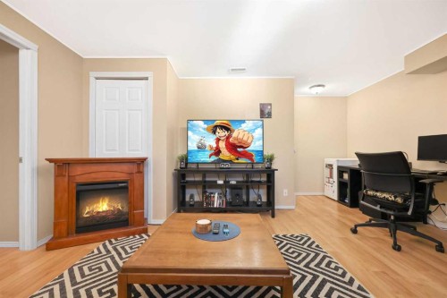 40 Eversyde Circle Sw, Calgary, AB - Indoor With Fireplace