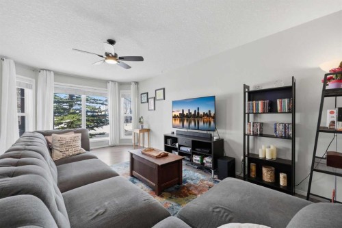 40 Eversyde Circle Sw, Calgary, AB - Indoor Photo Showing Living Room