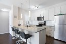 112-200 Cranfield Common Se, Calgary, AB  - Indoor Photo Showing Kitchen With Upgraded Kitchen 
