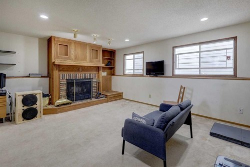16 Martingrove Mews Ne, Calgary, AB - Indoor Photo Showing Living Room With Fireplace