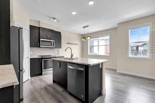 249 Sage Hill Grove Nw, Calgary, AB - Indoor Photo Showing Kitchen With Double Sink With Upgraded Kitchen
