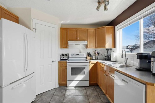 155 Tarington Green Ne, Calgary, AB - Indoor Photo Showing Kitchen With Double Sink