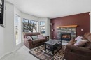 155 Tarington Green Ne, Calgary, AB  - Indoor Photo Showing Living Room With Fireplace 