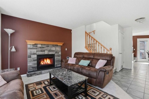 155 Tarington Green Ne, Calgary, AB - Indoor Photo Showing Living Room With Fireplace