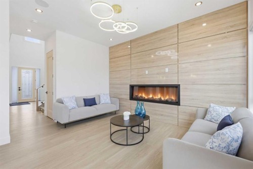 230 Royal Birch View Nw, Calgary, AB - Indoor Photo Showing Living Room With Fireplace