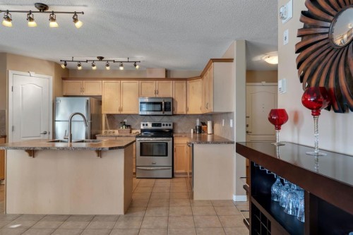 2117-303 Arbour Crest Drive Nw, Calgary, AB - Indoor Photo Showing Kitchen With Stainless Steel Kitchen