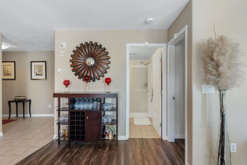 2117-303 Arbour Crest Drive Nw, Calgary, AB - Indoor Photo Showing Other Room With Fireplace
