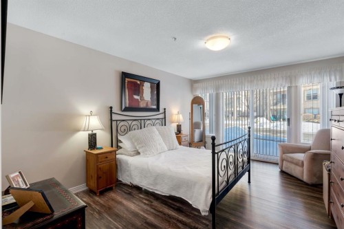 2117-303 Arbour Crest Drive Nw, Calgary, AB - Indoor Photo Showing Bedroom