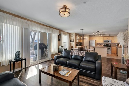 2117-303 Arbour Crest Drive Nw, Calgary, AB - Indoor Photo Showing Living Room