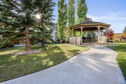 2117-303 Arbour Crest Drive Nw, Calgary, AB - Outdoor With Backyard
