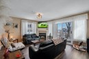 2117-303 Arbour Crest Drive Nw, Calgary, AB  - Indoor Photo Showing Living Room With Fireplace 