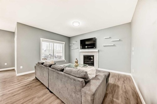 753 Edgefield Crescent, Strathmore, AB - Indoor Photo Showing Living Room With Fireplace
